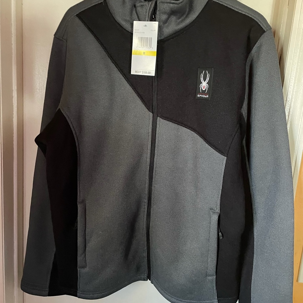 Gray and Black full zip up Jacket. Brand new. Tags attached. Never worn.